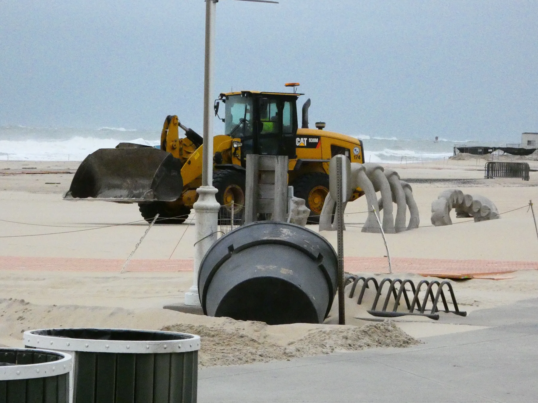 A loader moves sand near the festival site.
