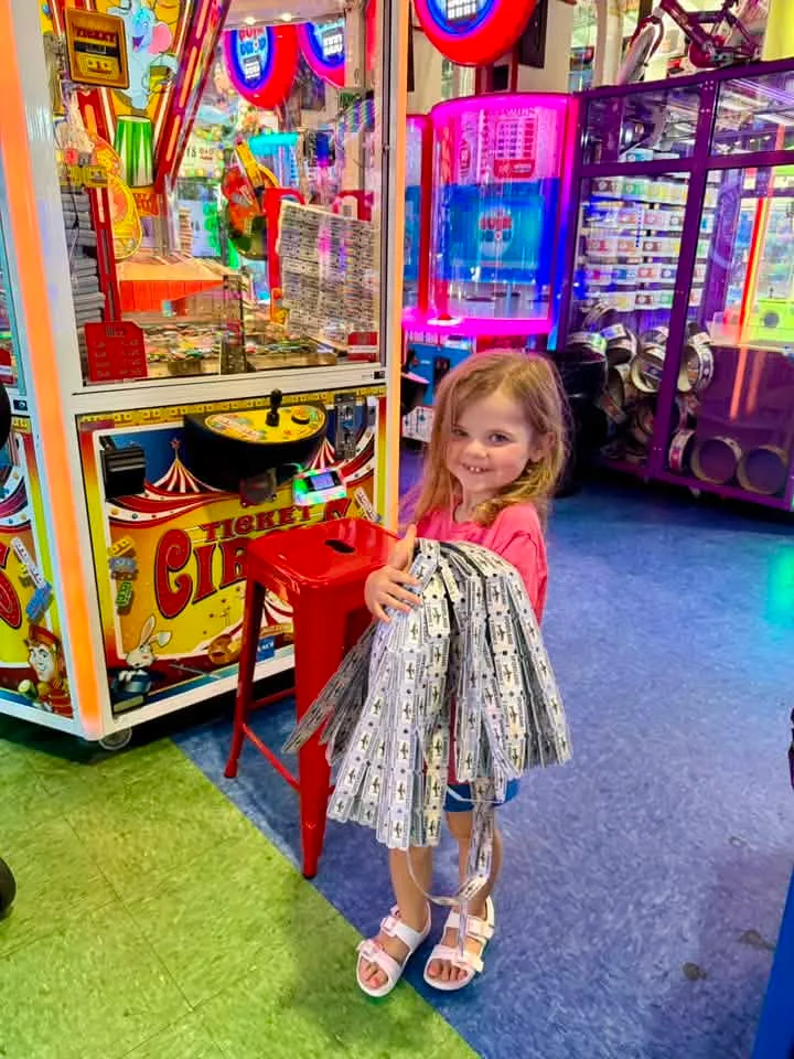 little girl winning tickets at the arcade in ocean city md