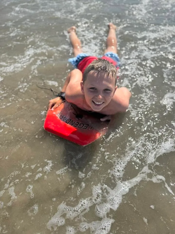 boy boogie boarding in ocean city md