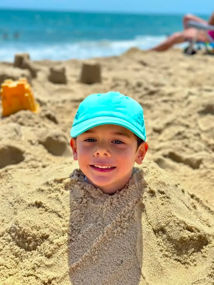 Katie Carnero - My son wanted to be buried in the sand, he thought this picture was so cool!