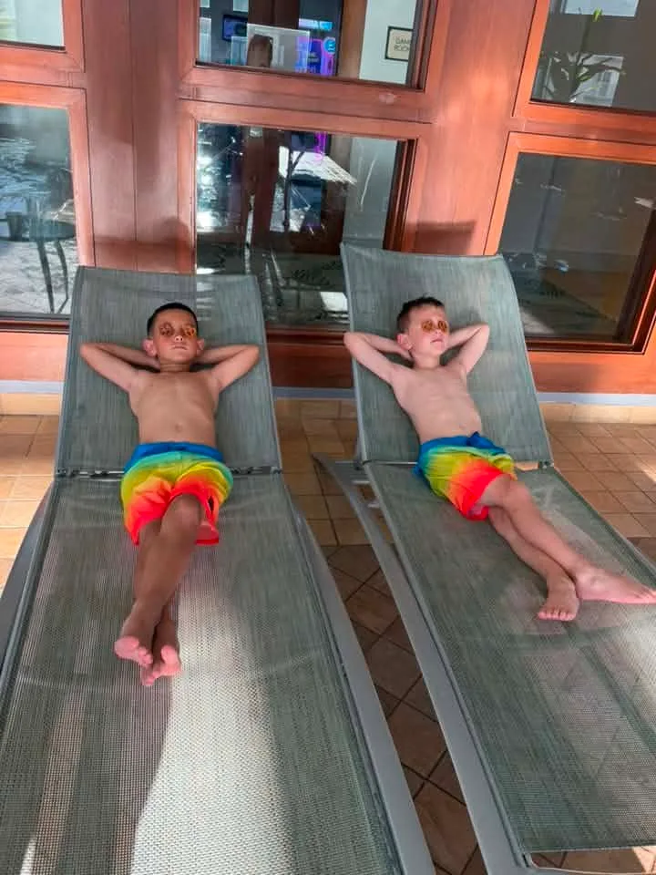 two boys sunbathing in ocean city md