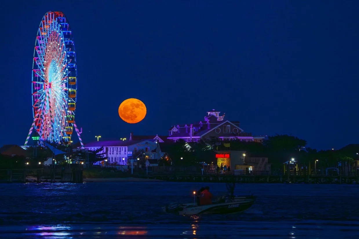 A full moon shines on the south side of the Ocean City Inlet. Photo Cred: Jim Halverson