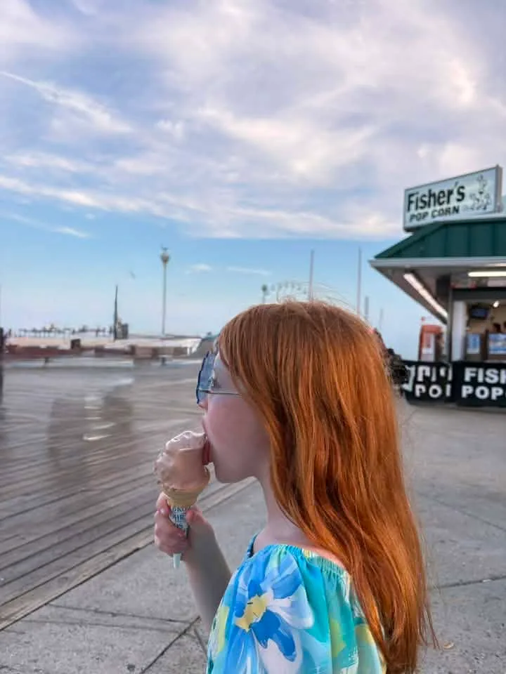 Girl eating ice cream on the ocean city boardwalk