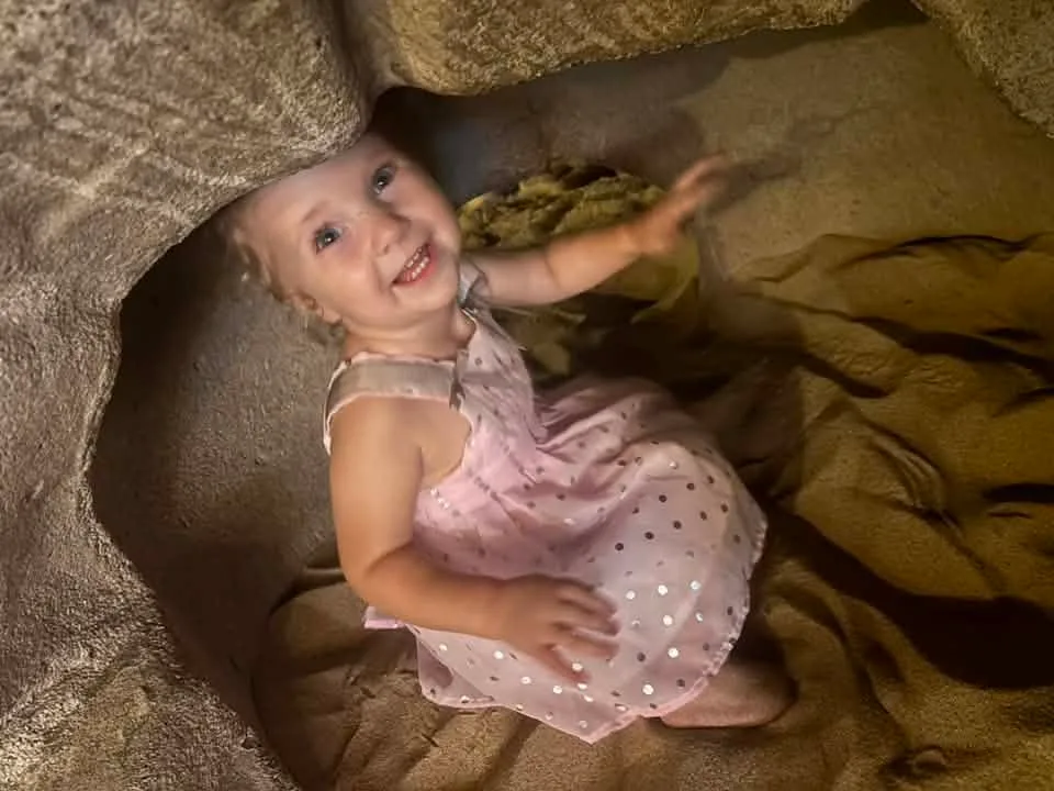 girl playing in dino egg in ocean city md