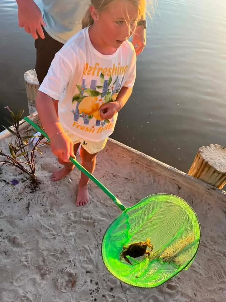 Moira M Twigg - Enjoying dinner at Saltwater 75 and Rowan caught a crab in the bay.