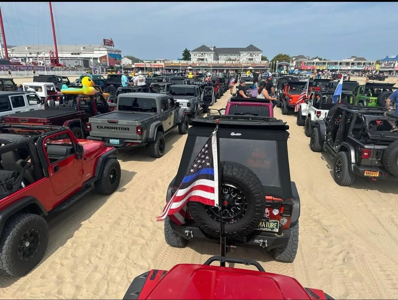 Jeeps line the Ocean City, MD inlet in preparation for the parade on the beach.