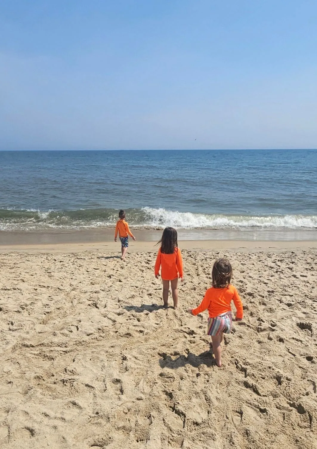 Kelly Conlin Harrar - Kids loving the beach and mom loving the neon to spot them easy on the beach