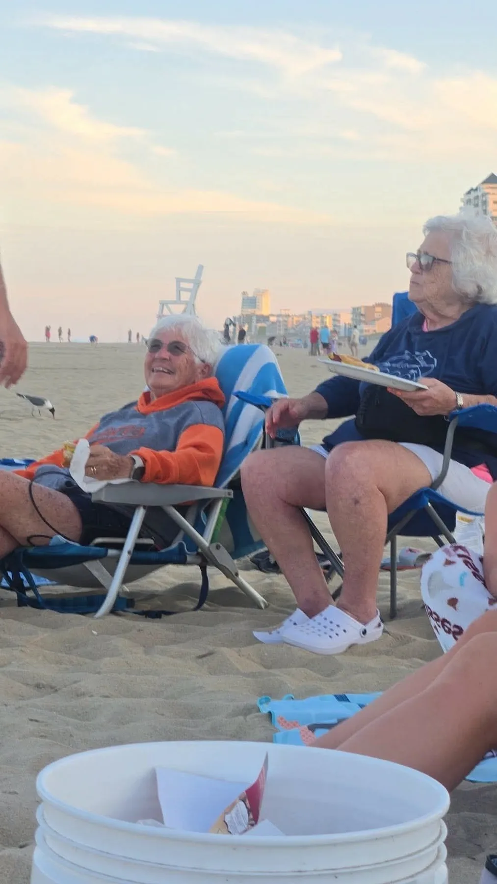 Lindsay Marie- My sisters in laws , the matriarchs, sitting around a fire at the beach