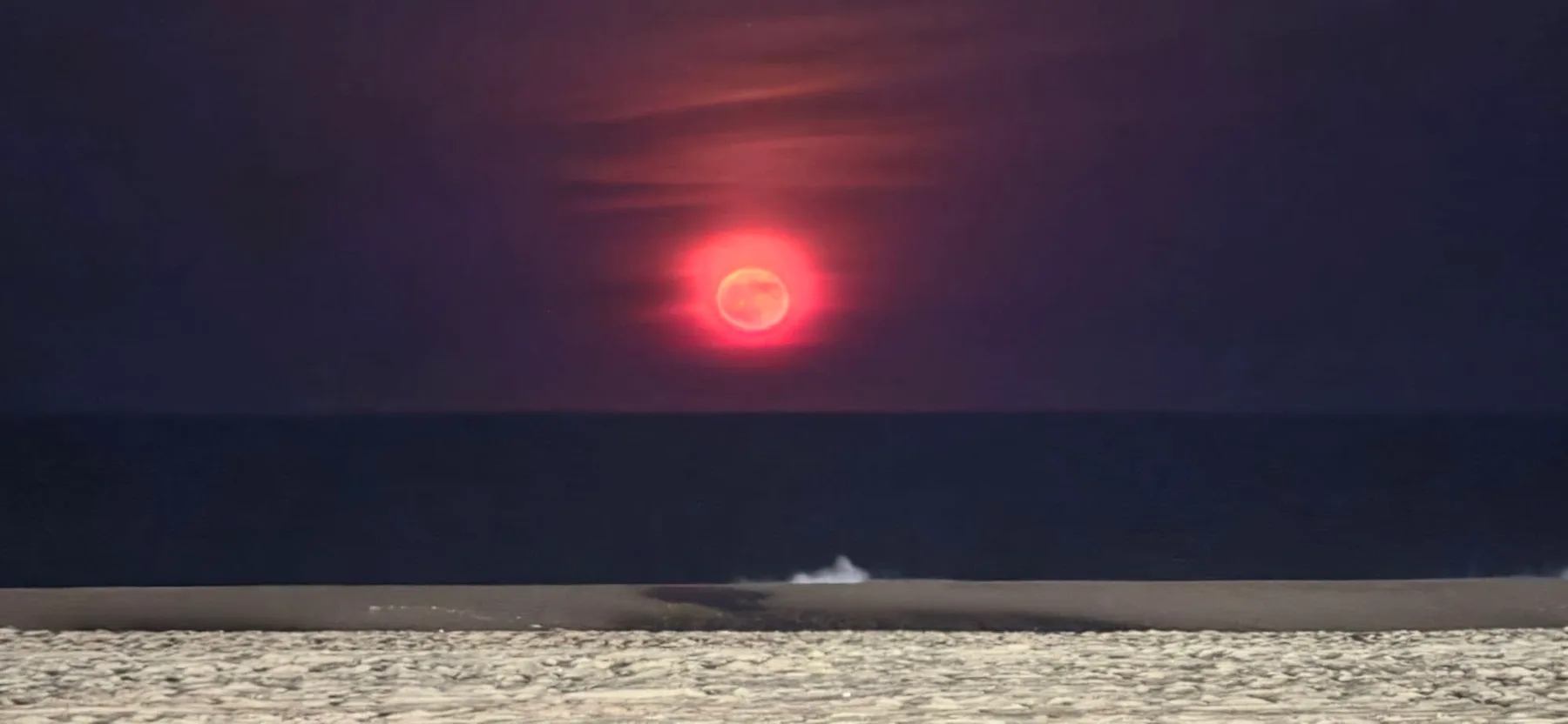 Jen Means - How do you just pick 1 when there is so many good ones. This was the Red Moon over the ocean 4th of July week