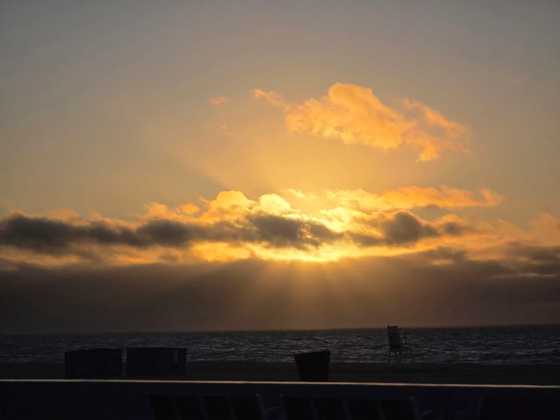 Lisa Fae Guernsey - Sunrise on 10 Street balcony in June 2026