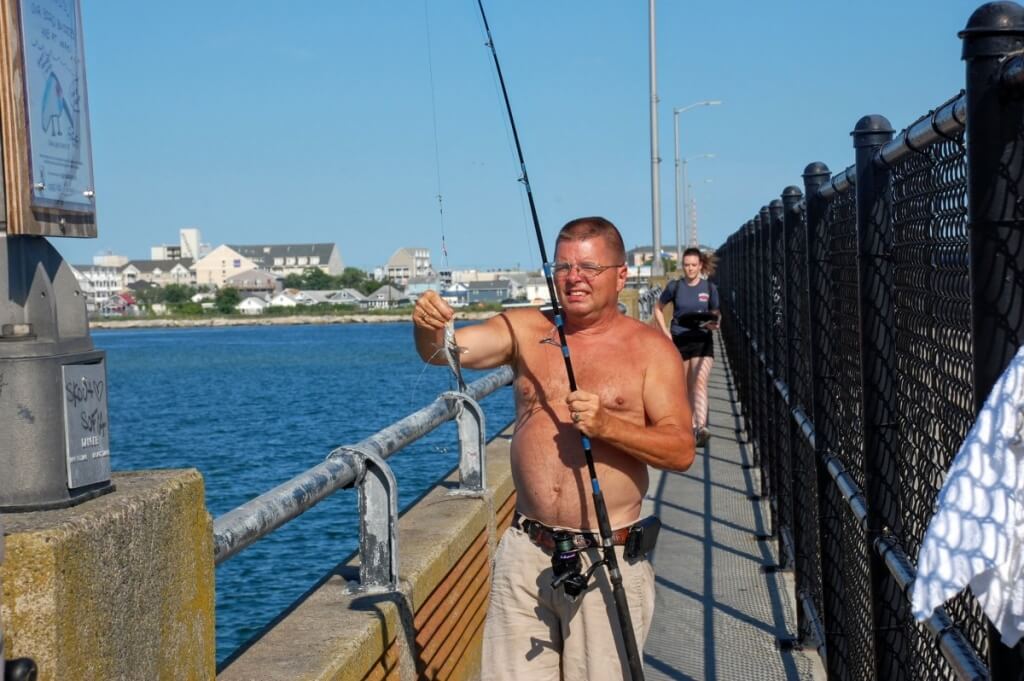 This gentleman is a fisherman on the bridge one week every year.