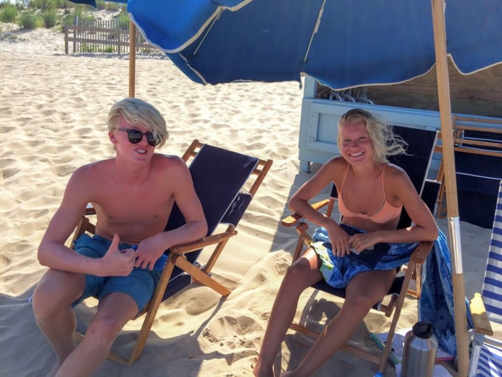 Umbrella stand kids are still working on their tans Memorial Day Weekend.