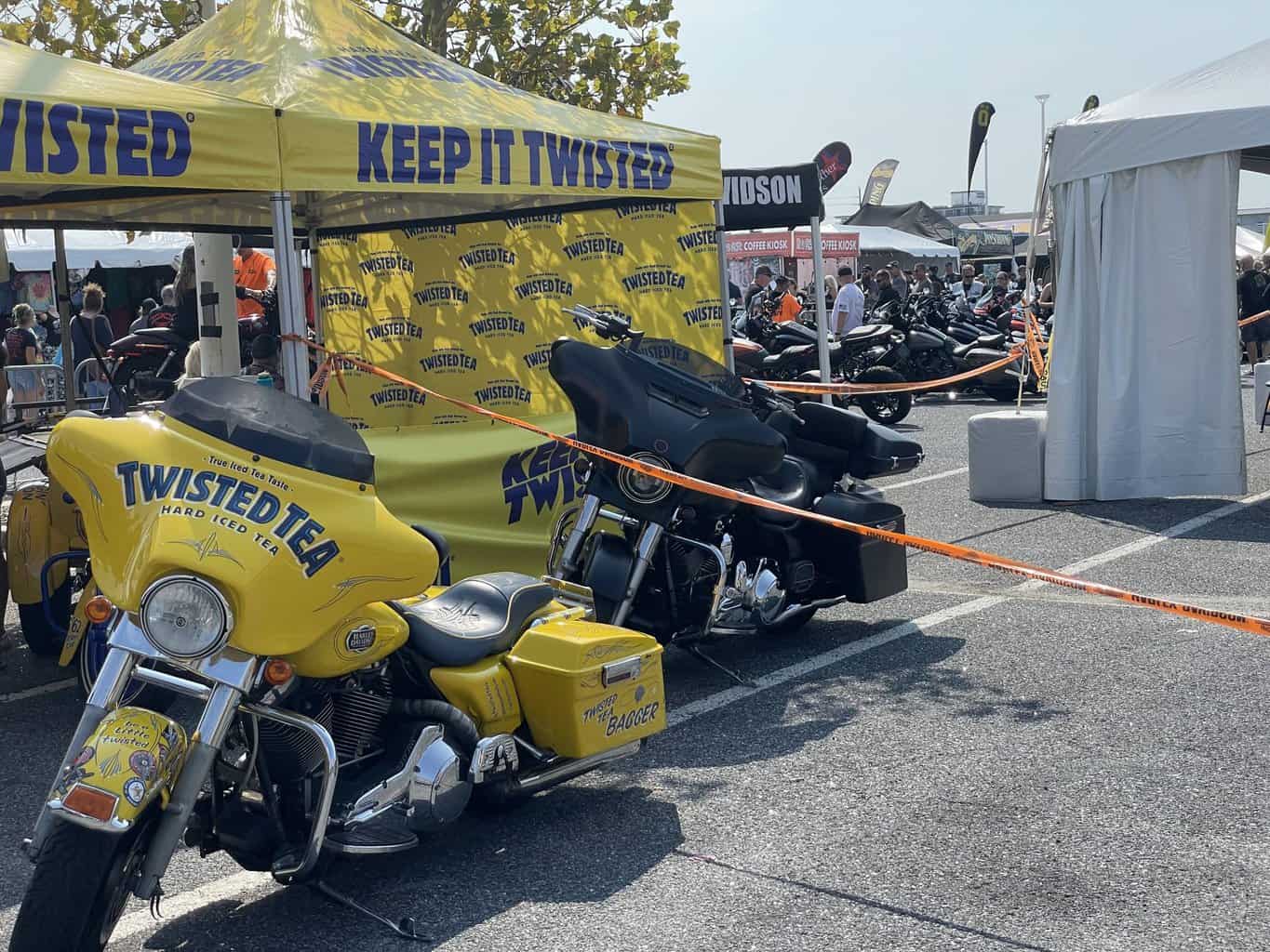Twisted tea tent and logo-ed bike at the vendor village