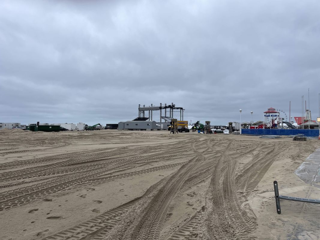 The beach is filled with tire tracks as they set up for Oceans Calling 2023