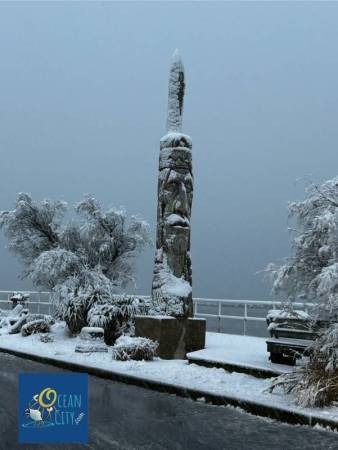 Inlet Native American sculpture with snow