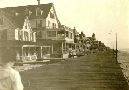 boardwalk with buildings old photo
