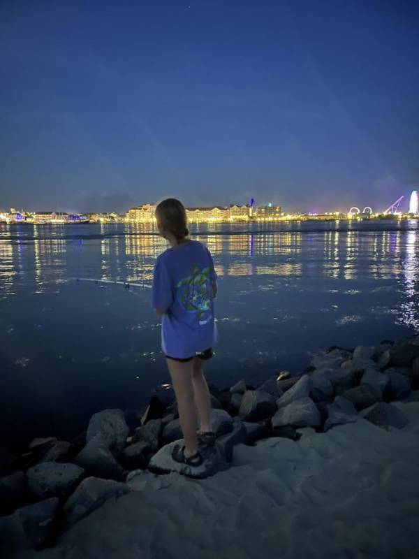 photo Friday Michael Smith Took my daughter night fishing on stinky beach. Beautifull lit up OC in the background.